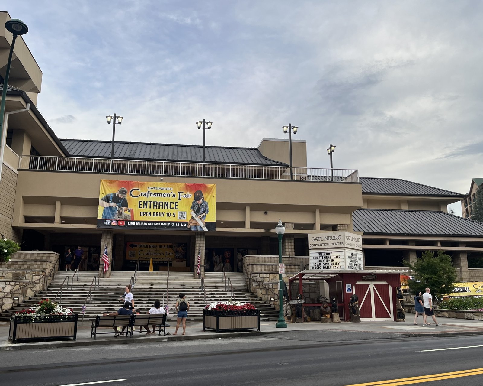 The Parkway entrance of the Gatlinburg Convention Center, with a large Gatlinburg Craftsmen's Fair entrance banner above the front steps.